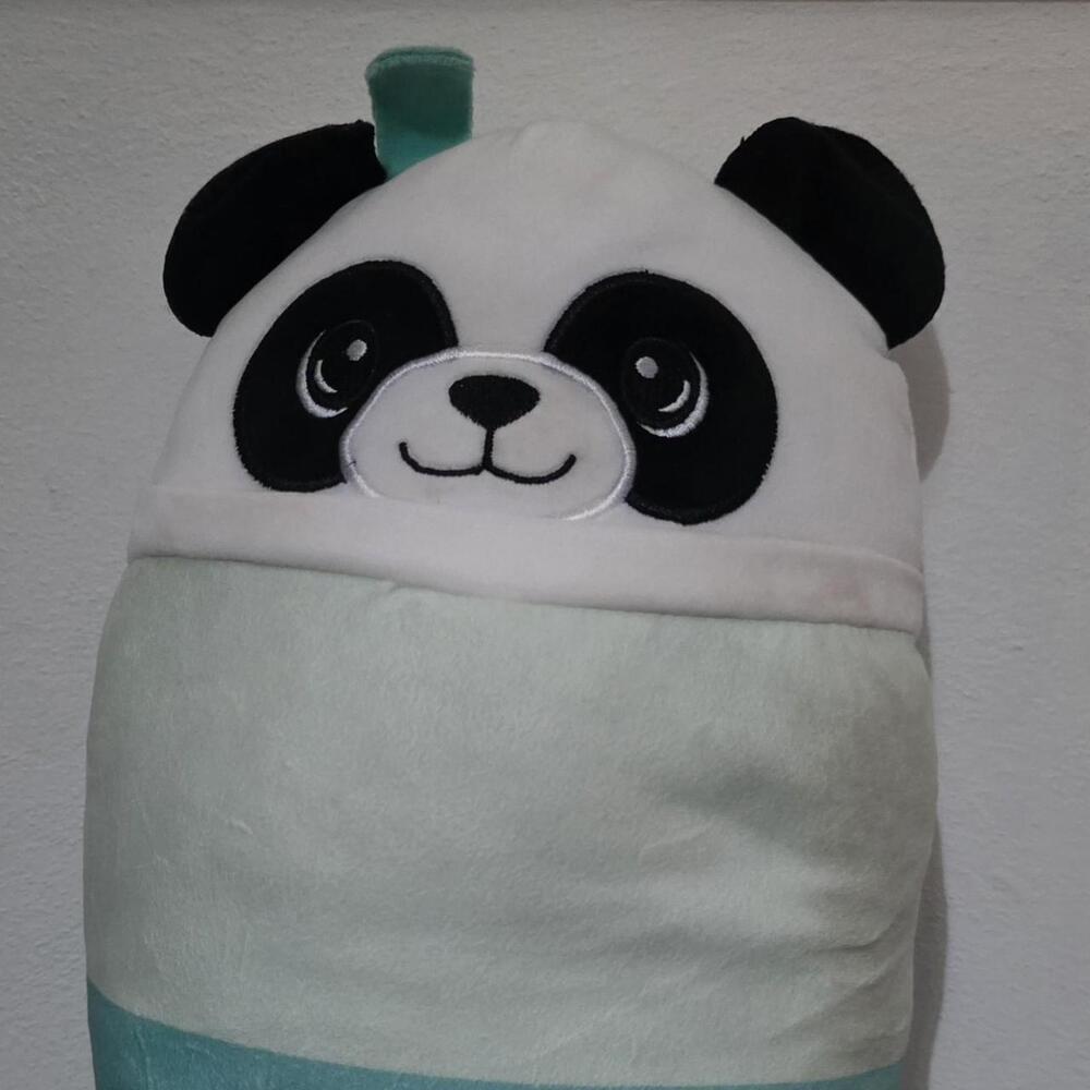 Panda plushie with black and white face, light green body, and teal trim #kawaii